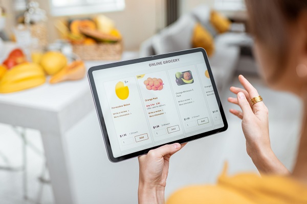 A Woman Checking With Her Digital Tablet About Online Shopping.