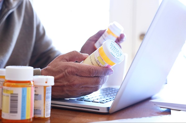 A man checking medicine online